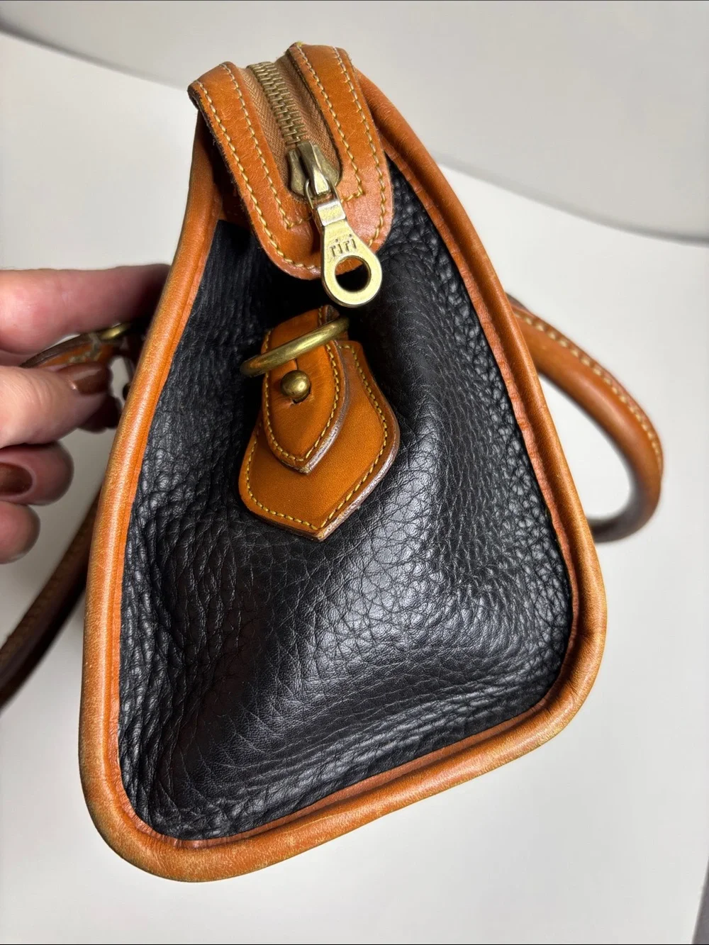 Dooney & Bourke Black Pebbled Leather Satchel with Tan Trim